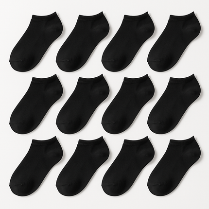 12 pairs of plain black low cut socks on white background